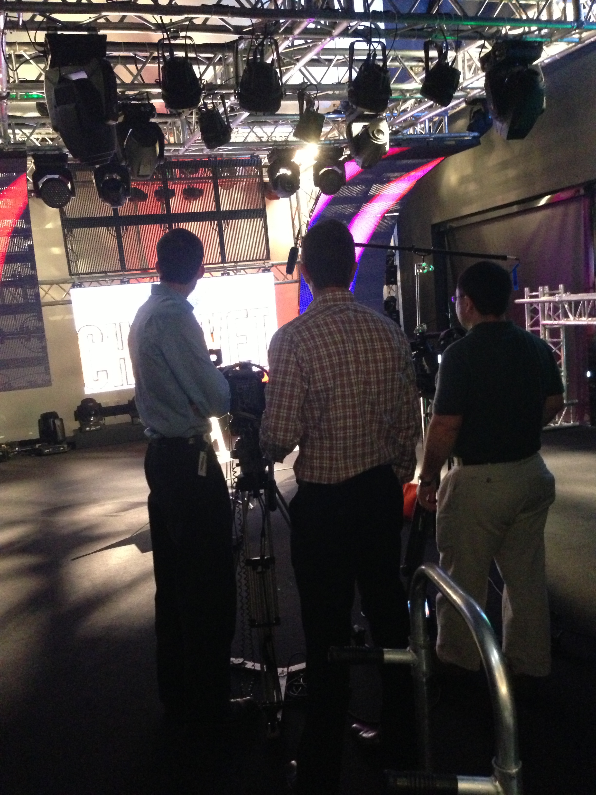JM Family crew setting up in front of CHAUVET  Professional VIP video products under a full Chauvet rig.